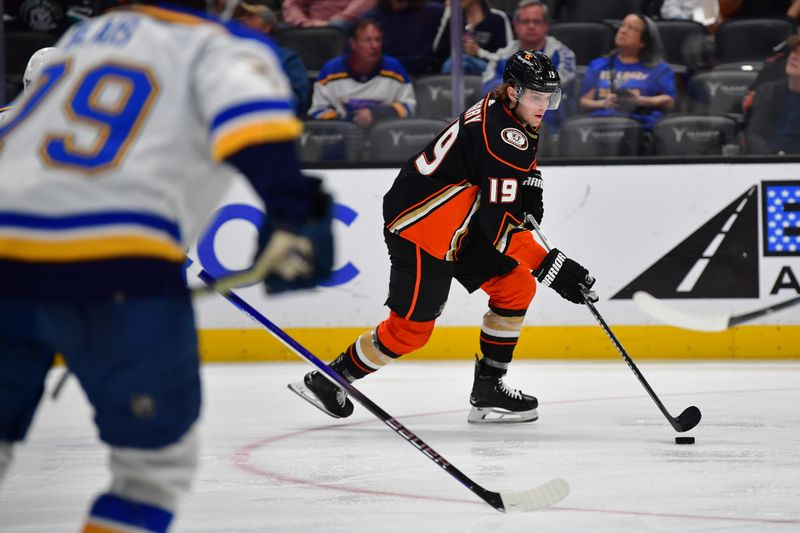 Apr 7, 2024; Anaheim, California, USA; Anaheim Ducks right wing Troy Terry (19) moves the puck against the St. Louis Blues during the second period at Honda Center. Mandatory Credit: Gary A. Vasquez-USA TODAY Sports