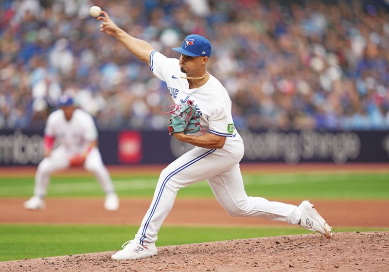 Sep 9, 2023; Toronto, Ontario, CAN; Toronto Blue Jays relief pitcher Jordan Hicks (12) pitches against the Kansas City Royals during the ninth inning at Rogers Centre. Mandatory Credit: Nick Turchiaro-USA TODAY Sports