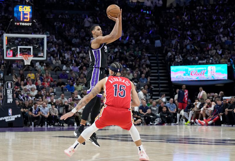 SACRAMENTO, CALIFORNIA - APRIL 11: Keegan Murray #13 of the Sacramento Kings shoots a three-point shot over Jose Alvarado #15 of the New Orleans Pelicans during the second half of an NBA basketball game at Golden 1 Center on April 11, 2024 in Sacramento, California. NOTE TO USER: User expressly acknowledges and agrees that, by downloading and or using this photograph, User is consenting to the terms and conditions of the Getty Images License Agreement. (Photo by Thearon W. Henderson/Getty Images)