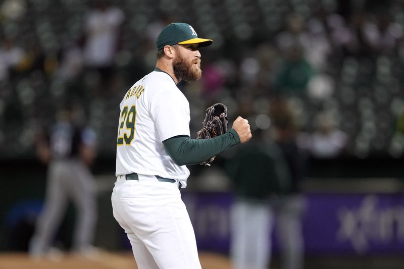 May 3, 2024; Oakland, California, USA; Oakland Athletics relief pitcher Austin Adams (29) reacts after the last out of the top of the seventh inning against the Miami Marlins at Oakland-Alameda County Coliseum. Mandatory Credit: Darren Yamashita-USA TODAY Sports