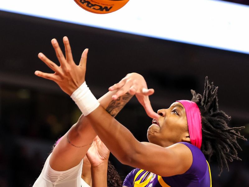 Feb 12, 2023; Columbia, South Carolina, USA; South Carolina Gamecocks center Kamilla Cardoso (10) blocks the shot of LSU Lady Tigers guard Alexis Morris (45) in the second half at Colonial Life Arena. Mandatory Credit: Jeff Blake-USA TODAY Sports