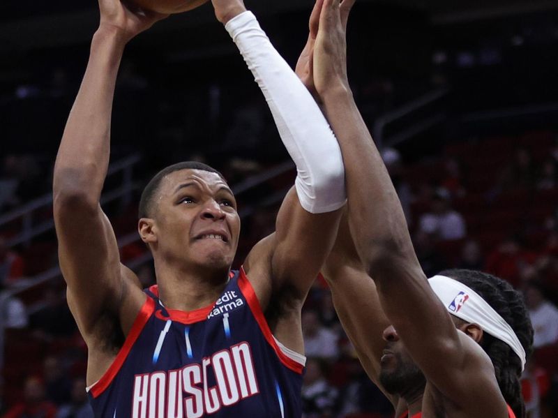 HOUSTON, TEXAS - FEBRUARY 03: Jabari Smith Jr. #1 of the Houston Rockets drives to the net against the Toronto Raptors during the first half at Toyota Center on February 03, 2023 in Houston, Texas. NOTE TO USER: User expressly acknowledges and agrees that, by downloading and or using this photograph, User is consenting to the terms and conditions of the Getty Images License Agreement. (Photo by Carmen Mandato/Getty Images)