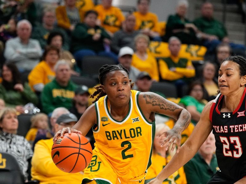 Feb 18, 2024; Waco, Texas, USA;  Baylor Lady Bears guard Yaya Felder (2) drives to the basket past Texas Tech Red Raiders guard Loghan Johnson (23) during the first half at Paul and Alejandra Foster Pavilion. Mandatory Credit: Chris Jones-USA TODAY Sports

