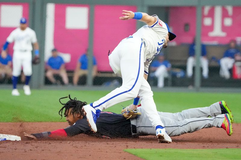 Sep 4, 2024; Kansas City, Missouri, USA; Kansas City Royals shortstop Bobby Witt Jr. (7) tags out Cleveland Guardians third baseman José Ramírez (11) trying to steal second base in the third inning at Kauffman Stadium. Mandatory Credit: Denny Medley-Imagn Images