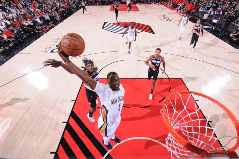 PORTLAND, OR - OCTOBER 25: Javonte Green #4 of the New Orleans Pelicans dunks the ball during the game against the Portland Trail Blazers on October 25, 2024 at the Moda Center Arena in Portland, Oregon. NOTE TO USER: User expressly acknowledges and agrees that, by downloading and or using this photograph, user is consenting to the terms and conditions of the Getty Images License Agreement. Mandatory Copyright Notice: Copyright 2024 NBAE (Photo by Cameron Browne/NBAE via Getty Images)