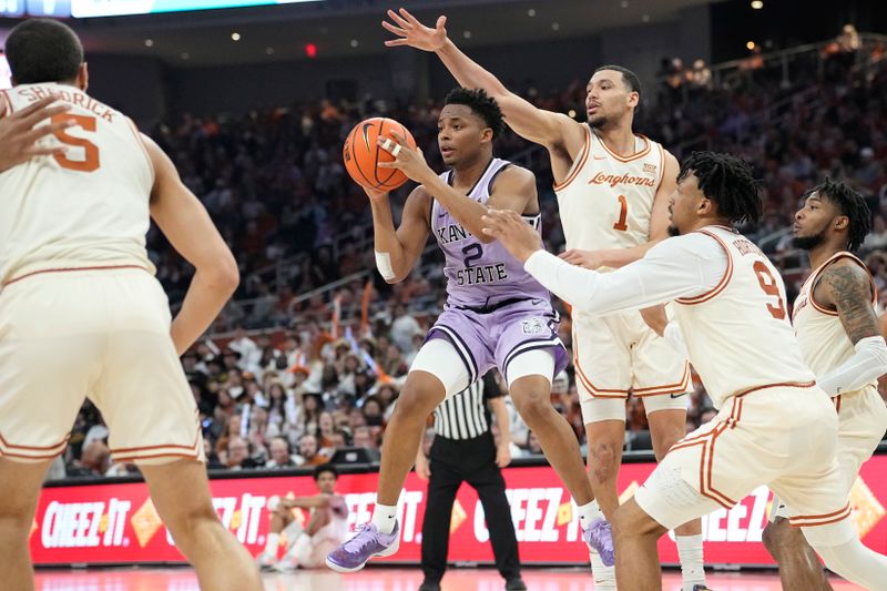 Feb 19, 2024; Austin, Texas, USA; Kansas State Wildcats guard Tylor Perry (2) looks to pass the ball while defended by Texas Longhorns forward Dylan Disu (1) and guard Ithiel Horton (9) during the second half at Moody Center. Mandatory Credit: Scott Wachter-USA TODAY Sports