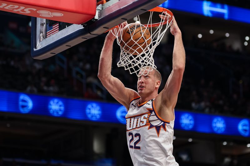 WASHINGTON, DC - JANUARY 16: Mason Plumlee #22 of the Phoenix Suns dunks against the Washington Wizards during the first half at Capital One Arena on January 16, 2025 in Washington, DC. NOTE TO USER: User expressly acknowledges and agrees that, by downloading and or using this photograph, User is consenting to the terms and conditions of the Getty Images License Agreement. (Photo by Scott Taetsch/Getty Images)