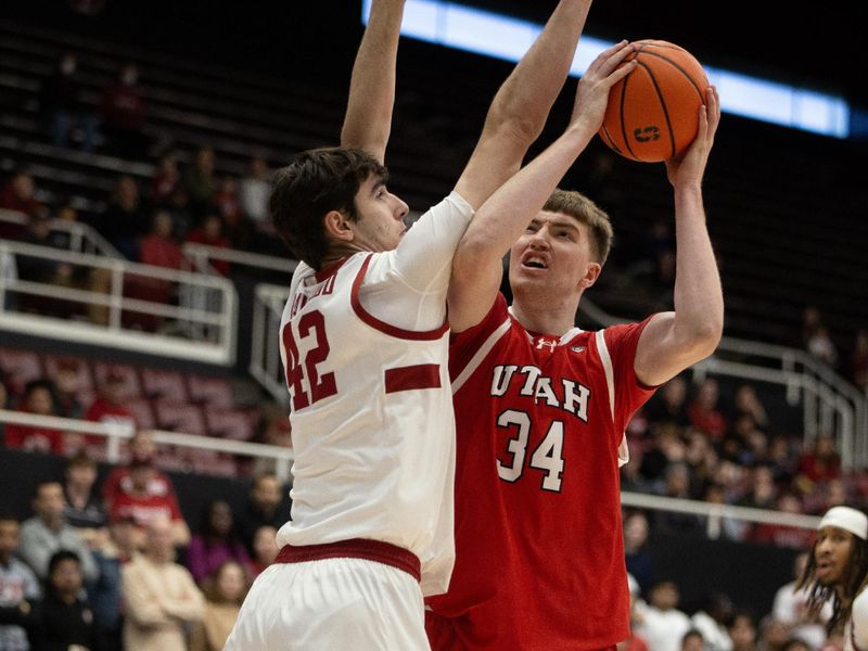 Jan 14, 2024; Stanford, California, USA; Utah Utes center Lawson Lovering (34) looks to shoot over Stanford Cardinal forward Maxime Raynaud (42) during the first half at Maples Pavilion. Mandatory Credit: D. Ross Cameron-USA TODAY Sports