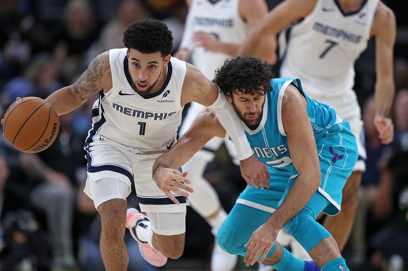 MEMPHIS, TENNESSEE - OCTOBER 10: Scotty Pippen Jr. #1 of the Memphis Grizzlies and Vasilije Micic #22 of the Charlotte Hornets fight for the ball during the second half at FedExForum on October 10, 2024 in Memphis, Tennessee. NOTE TO USER: User expressly acknowledges and agrees that, by downloading and or using this photograph, User is consenting to the terms and conditions of the Getty Images License Agreement. (Photo by Justin Ford/Getty Images)