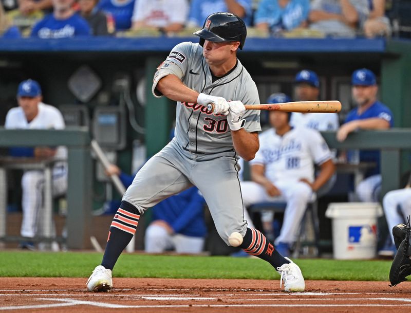 Sep 18, 2024; Kansas City, Missouri, USA;  Detroit Tigers designated hitter Kerry Carpenter (30) gets hit with a pitch in the first inning against the Kansas City Royals at Kauffman Stadium. Mandatory Credit: Peter Aiken-Imagn Images