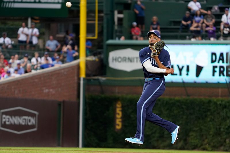 Jul 14, 2023; Chicago, Illinois, USA; Chicago Cubs second baseman Christopher Morel (5) makes a play on Boston Red Sox designated hitter Masataka Yoshida (not pictured) during the first inning at Wrigley Field. Mandatory Credit: David Banks-USA TODAY Sports