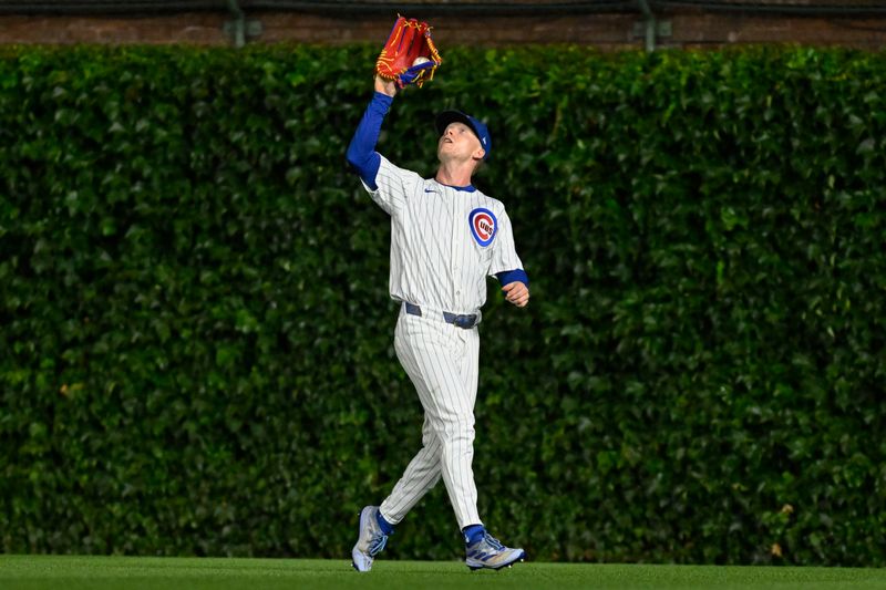 Jul 23, 2024; Chicago, Illinois, USA;  Chicago Cubs outfielder Pete Crow-Armstrong (52) catches a fly ball hit by Milwaukee Brewers catcher William Contreras (24) during the fourth inning at Wrigley Field. Mandatory Credit: Matt Marton-USA TODAY Sports