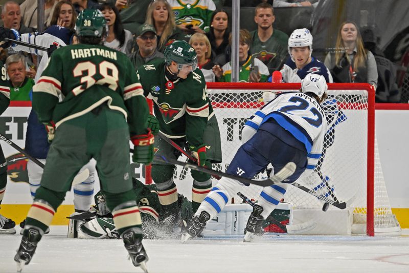 Sep 27, 2024; Saint Paul, Minnesota, USA;  Winnipeg Jets forward Mason Appleton (22) scores a goal against the Minnesota Wild during the second period at Xcel Energy Center. Mandatory Credit: Nick Wosika-Imagn Images

