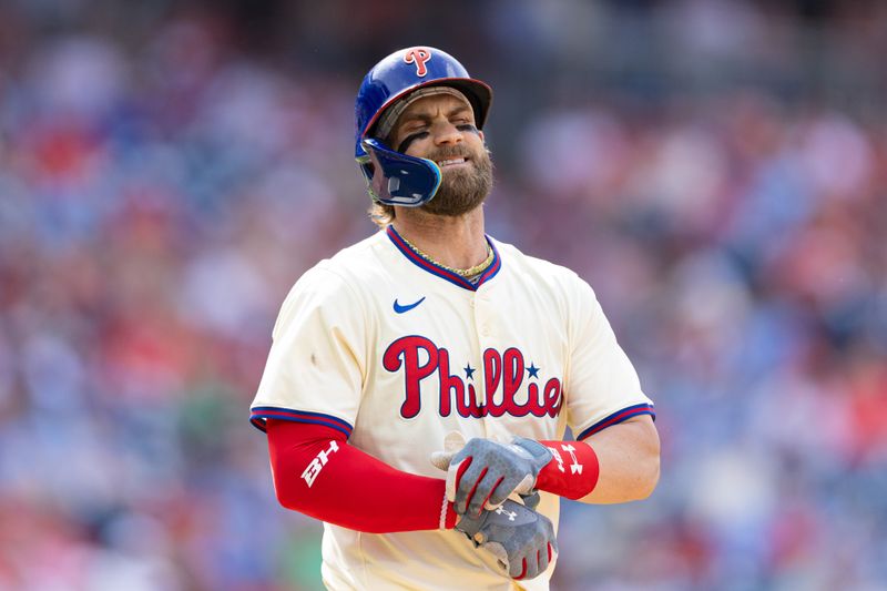 May 8, 2024; Philadelphia, Pennsylvania, USA; Philadelphia Phillies first base Bryce Harper (3) reacts to grounding out to end the eighth inning against the Toronto Blue Jays at Citizens Bank Park. Mandatory Credit: Bill Streicher-USA TODAY Sports