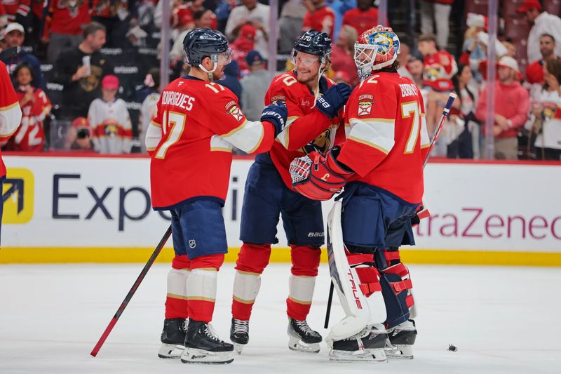 May 24, 2025; Sunrise, Florida, USA; The Florida Panthers celebrate the win against the Carolina Hurricanes in game three of the Eastern Conference Final of the 2025 Stanley Cup Playoffs at Amerant Bank Arena. Mandatory Credit: Sam Navarro-Imagn Images