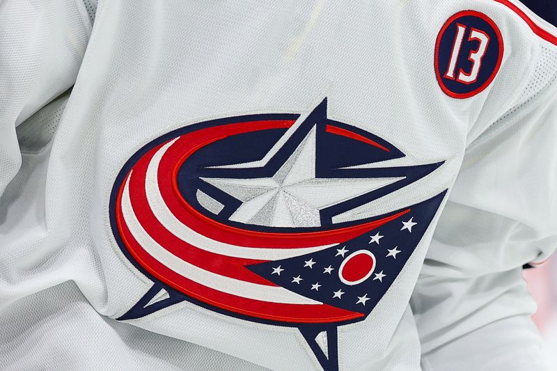 Oct 10, 2024; Saint Paul, Minnesota, USA; A patch honoring the life Johnny Gaudreau is seen on the jersey worn by Columbus Blue Jackets right wing Yegor Chinakhov (59) during the first period at Xcel Energy Center. Mandatory Credit: Matt Krohn-Imagn Images