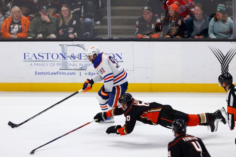 Feb 9, 2024; Anaheim, California, USA; Edmonton Oilers left wing Evander Kane (91) skates with the puck on a breakaway during the third period of a game against the Anaheim Ducks at Honda Center. Mandatory Credit: Jessica Alcheh-USA TODAY Sports