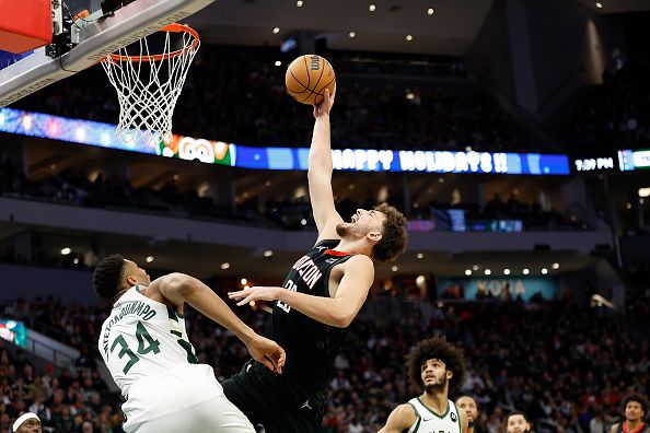 MILWAUKEE, WISCONSIN - DECEMBER 17: Alperen Sengun #28 of the Houston Rockets goes in for a shot on Giannis Antetokounmpo #34 of the Milwaukee Bucks during the second half of the game at Fiserv Forum on December 17, 2023 in Milwaukee, Wisconsin. NOTE TO USER: User expressly acknowledges and agrees that, by downloading and or using this photograph, User is consenting to the terms and conditions of the Getty Images License Agreement. (Photo by John Fisher/Getty Images)