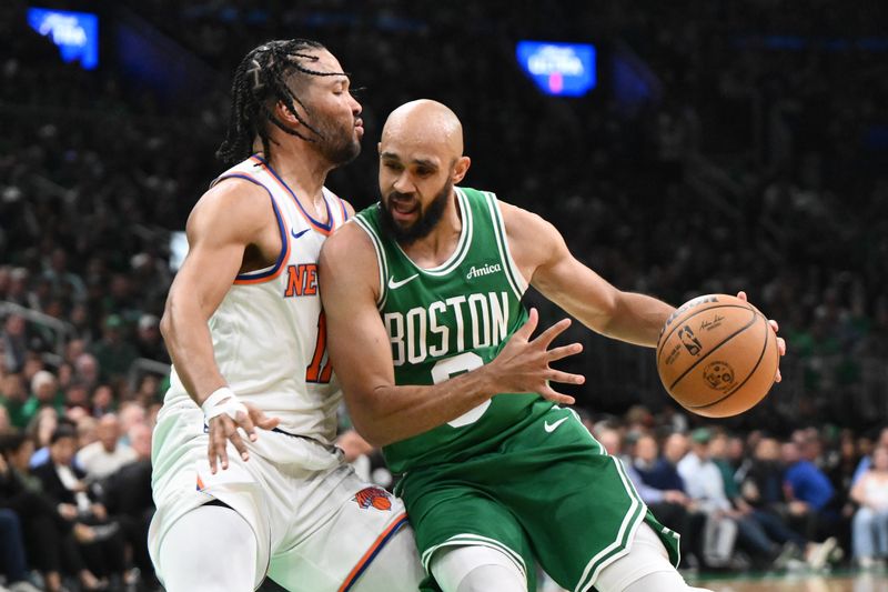 BOSTON, MASSACHUSETTS - OCTOBER 22: Derrick White #9 of the Boston Celtics makes a move on Jalen Brunson #11 of the New York Knicks during the third quarter at TD Garden on October 22, 2024 in Boston, Massachusetts. (Photo by Brian Fluharty/Getty Images)