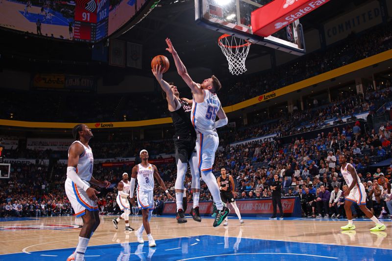 OKLAHOMA CITY, OK - NOVEMBER 20: Isaiah Hartenstein #55 of the Oklahoma City Thunder blocks the basket during the game against the Portland Trail Blazers on November 20, 2024 at Paycom Center in Oklahoma City, Oklahoma. NOTE TO USER: User expressly acknowledges and agrees that, by downloading and or using this photograph, User is consenting to the terms and conditions of the Getty Images License Agreement. Mandatory Copyright Notice: Copyright 2024 NBAE (Photo by Zach Beeker/NBAE via Getty Images)