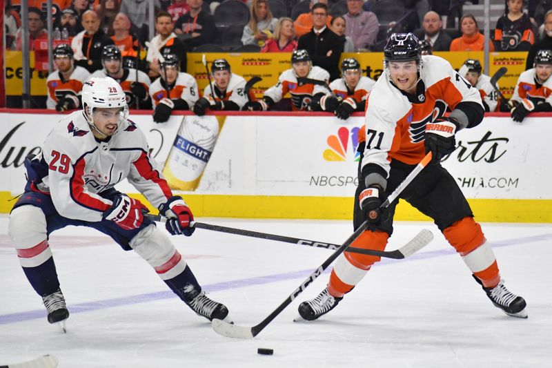 Apr 16, 2024; Philadelphia, Pennsylvania, USA; Philadelphia Flyers right wing Tyson Foerster (71) and Washington Capitals center Hendrix Lapierre (29) battle for the puck during the second period at Wells Fargo Center. Mandatory Credit: Eric Hartline-USA TODAY Sports