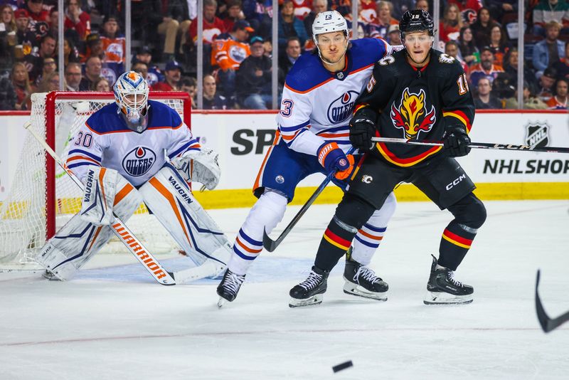 Apr 6, 2024; Calgary, Alberta, CAN; Calgary Flames left wing Dryden Hunt (15) and Edmonton Oilers center Mattias Janmark (13) fights for position in front of Edmonton Oilers goaltender Calvin Pickard (30) during the second period at Scotiabank Saddledome. Mandatory Credit: Sergei Belski-USA TODAY Sports