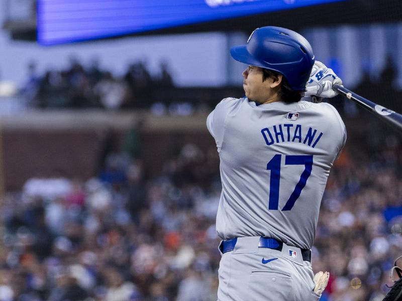 May 15, 2024; San Francisco, California, USA; Los Angeles Dodgers designated hitter Shohei Ohtani (17) hits a single against the San Francisco Giants during the fifth inning at Oracle Park. Mandatory Credit: John Hefti-USA TODAY Sports