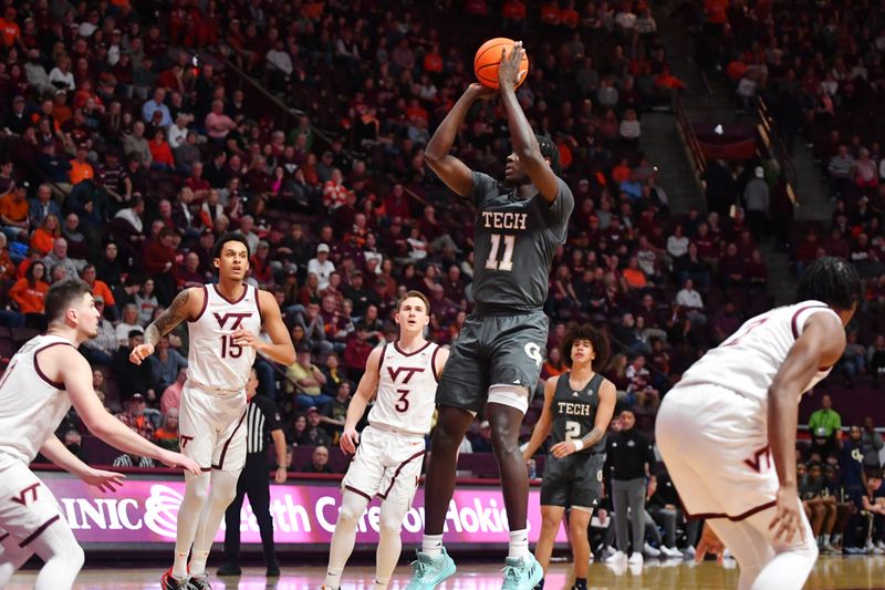 Jan 27, 2024; Blacksburg, Virginia, USA; Georgia Tech Yellow Jackets forward Baye Ndongo (11) shoots over Virginia Tech Hokies defenders during the first half at Cassell Coliseum. Mandatory Credit: Brian Bishop-USA TODAY Sports