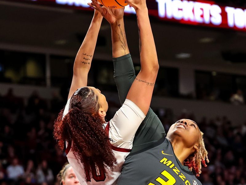 Jan 15, 2023; Columbia, South Carolina, USA; South Carolina Gamecocks center Kamilla Cardoso (10) and Missouri Tigers center Jayla Kelly (32) battle for a rebound in the first half at Colonial Life Arena. Mandatory Credit: Jeff Blake-USA TODAY Sports