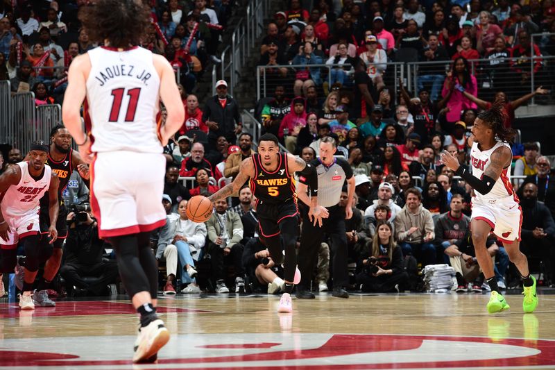 ATLANTA, GA - APRIL 9: Dejounte Murray #5 of the Atlanta Hawks dribbles the ball during the game against the Miami Heat on April 9, 2024 at State Farm Arena in Atlanta, Georgia.  NOTE TO USER: User expressly acknowledges and agrees that, by downloading and/or using this Photograph, user is consenting to the terms and conditions of the Getty Images License Agreement. Mandatory Copyright Notice: Copyright 2024 NBAE (Photo by Scott Cunningham/NBAE via Getty Images)