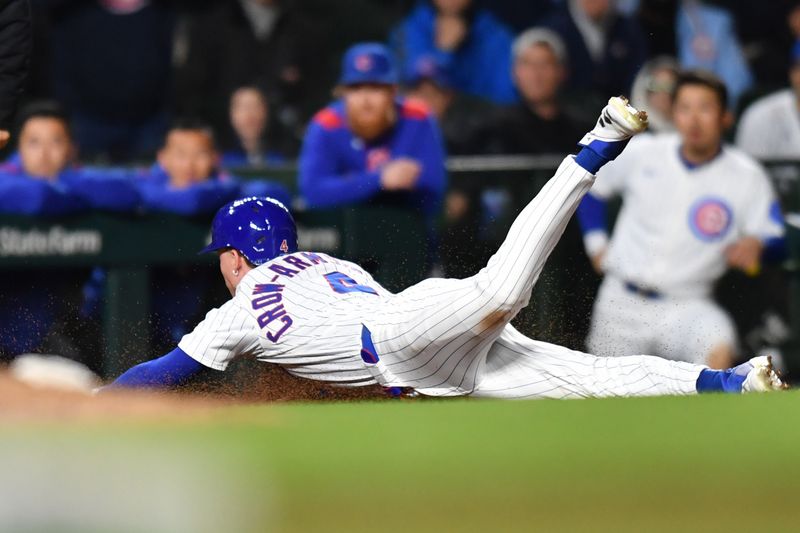 May 27, 2025; Chicago, Illinois, USA; Chicago Cubs center fielder Pete Crow-Armstrong (4) steals third base during the eleventh inning against the Colorado Rockies at Wrigley Field. Mandatory Credit: Patrick Gorski-Imagn Images