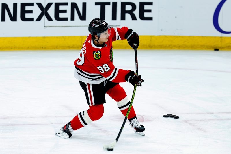 Dec 4, 2024; Chicago, Illinois, USA; Chicago Blackhawks center Connor Bedard (98) warms up before a game against the Boston Bruins at United Center. Mandatory Credit: Kamil Krzaczynski-Imagn Images