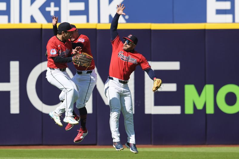 Apr 21, 2024; Cleveland, Ohio, USA; Cleveland Guardians left fielder Steven Kwan (38) and center fielder Ramon Laureano (10) and right fielder Will Brennan (17) celebrate after the Guardians beat the Oakland Athletics at Progressive Field. Mandatory Credit: Ken Blaze-USA TODAY Sports