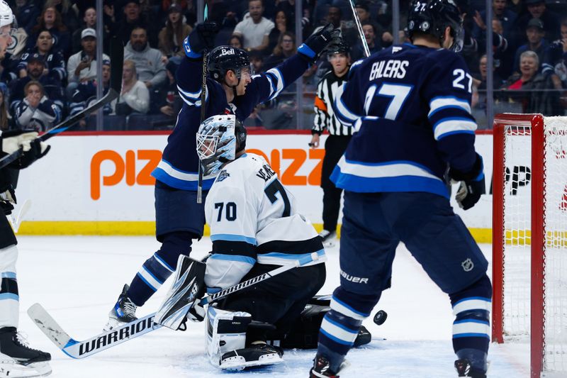 Nov 5, 2024; Winnipeg, Manitoba, CAN;  Winnipeg Jets forward Gabriel Vilardi (13) celebrates his goal against Utah Hockey Club goalie Karel Vejmelka (70) during the second period at Canada Life Centre. Mandatory Credit: Terrence Lee-Imagn Images