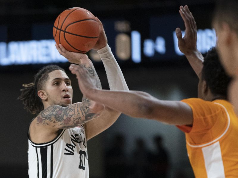 Feb 8, 2023; Nashville, Tennessee, USA;   Vanderbilt Commodores forward Myles Stute (10) shoots past a Tennessee Volunteers defender during the first half at Memorial Gymnasium.  Mandatory Credit: George Walker IV - USA TODAY Sports