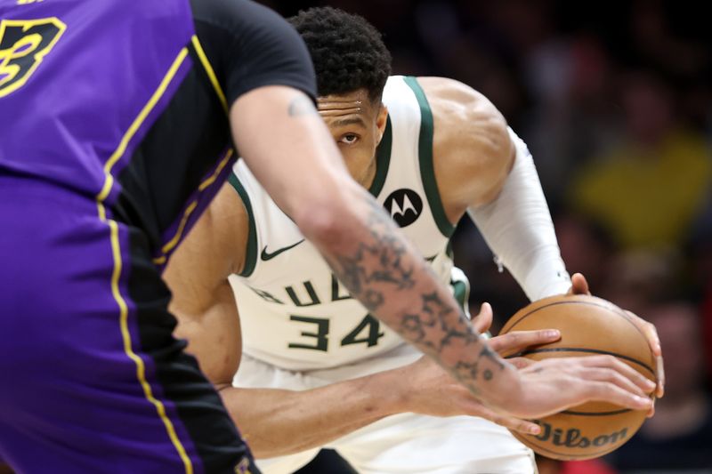 LOS ANGELES, CALIFORNIA - MARCH 08: Anthony Davis #3 of the Los Angeles Lakers defends against the dribble of Giannis Antetokounmpo #34 of the Milwaukee Bucks during the first half of a game at Crypto.com Arena on March 08, 2024 in Los Angeles, California. (Photo by Sean M. Haffey/Getty Images)