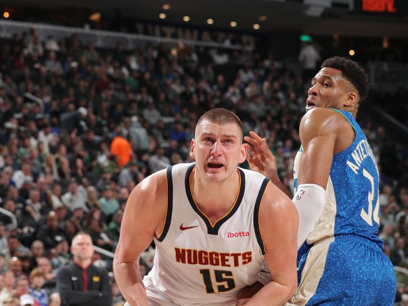 MILWAUKEE, WI - FEBRUARY 12: Nikola Jokic #15 of the Denver Nuggets drives to the basket during the game against the Milwaukee Bucks on February 12, 2024 at the Fiserv Forum Center in Milwaukee, Wisconsin. NOTE TO USER: User expressly acknowledges and agrees that, by downloading and or using this Photograph, user is consenting to the terms and conditions of the Getty Images License Agreement. Mandatory Copyright Notice: Copyright 2024 NBAE (Photo by Gary Dineen/NBAE via Getty Images).