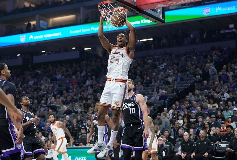 SACRAMENTO, CALIFORNIA - MARCH 07: Devin Vassell #24 of the San Antonio Spurs slam dunks against the Sacramento Kings during the first half at Golden 1 Center on March 07, 2024 in Sacramento, California. NOTE TO USER: User expressly acknowledges and agrees that, by downloading and or using this photograph, User is consenting to the terms and conditions of the Getty Images License Agreement. (Photo by Thearon W. Henderson/Getty Images)