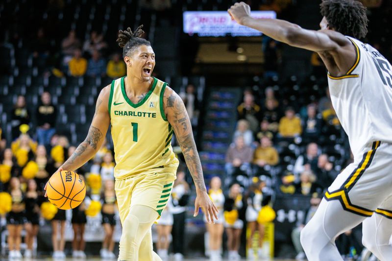 Jan 14, 2025; Wichita, Kansas, USA; Charlotte 49ers forward Giancarlo Rosado (1) brings the ball up court during the first half against the Wichita State Shockers at Charles Koch Arena. Mandatory Credit: William Purnell-Imagn Images