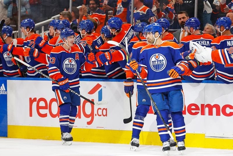 Jan 6, 2024; Edmonton, Alberta, CAN; The Edmonton Oilers celebrate after a goal by defensemen Evan Bouchard (2) against the Ottawa Senators during the second period at Rogers Place. Mandatory Credit: Perry Nelson-USA TODAY Sports