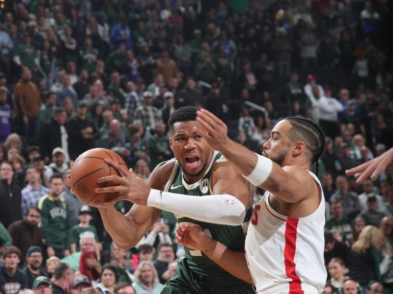 MILWAUKEE, WI - NOVEMBER 18: Giannis Antetokounmpo #34 of the Milwaukee Bucks looks to pass the ball during the game against the Houston Rockets on November 18, 2024 at the Fiserv Forum Center in Milwaukee, Wisconsin. NOTE TO USER: User expressly acknowledges and agrees that, by downloading and or using this Photograph, user is consenting to the terms and conditions of the Getty Images License Agreement. Mandatory Copyright Notice: Copyright 2024 NBAE (Photo by Gary Dineen/NBAE via Getty Images).