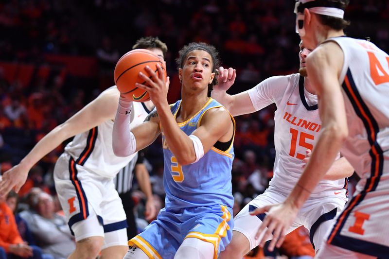 Dec 29, 2025; Champaign, Illinois, USA;  Southern University Jaguars guard Cam Amboree (3) drives the ball between Illinois Fighting Illini players during the second half at State Farm Center. Mandatory Credit: Ron Johnson-Imagn Images