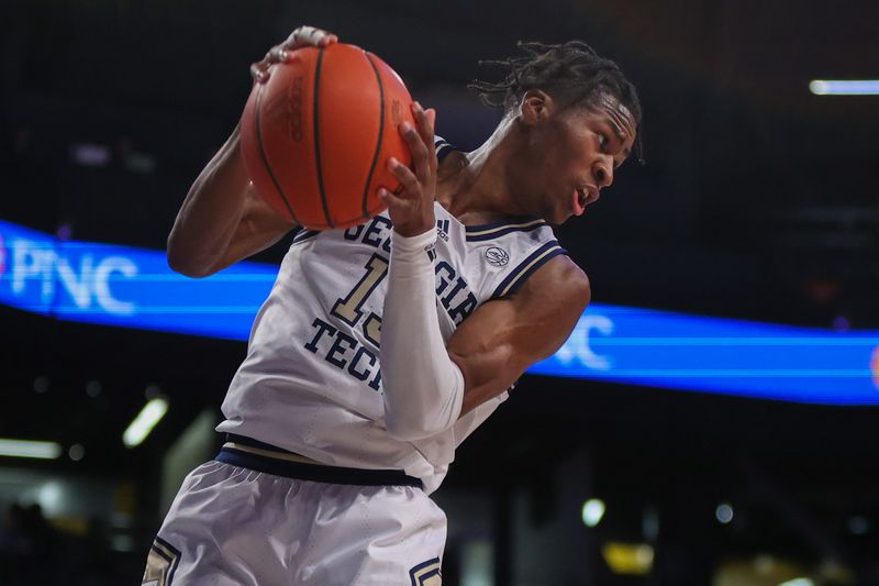 Jan 4, 2023; Atlanta, Georgia, USA; Georgia Tech Yellow Jackets guard Jakai Robinson (13) grabs a rebound against the Miami Hurricanes in the first half at McCamish Pavilion. Mandatory Credit: Brett Davis-USA TODAY Sports
