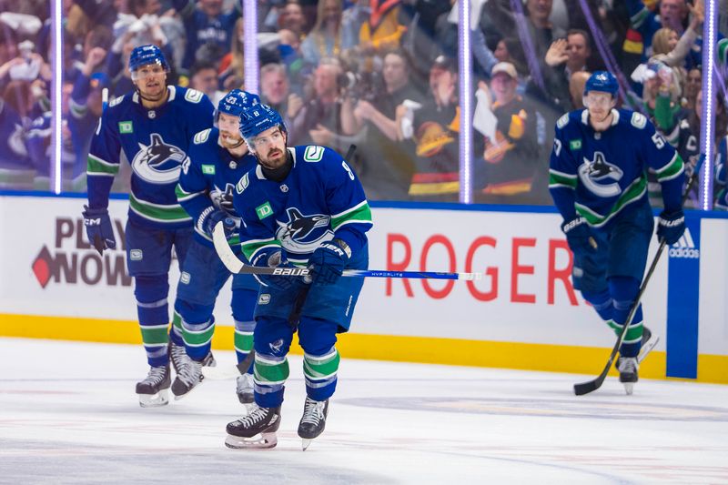 May 8, 2024; Vancouver, British Columbia, CAN; Vancouver Canucks forward Dakota Joshua (81) and defenseman Carson Soucy (7) and forward Conor Garland (8) and defenseman Tyler Myers (57) and forward Elias Lindholm (23) celebrate Garland’s game winning goal against the Edmonton Oilers during the third period in game one of the second round of the 2024 Stanley Cup Playoffs at Rogers Arena. Mandatory Credit: Bob Frid-USA TODAY Sports