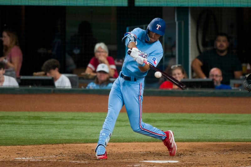 Sep 10, 2023; Arlington, Texas, USA; Texas Rangers left fielder Evan Carter (32) bats against the Oakland Athletics during the fifth inning at Globe Life Field. Mandatory Credit: Jerome Miron-USA TODAY Sports