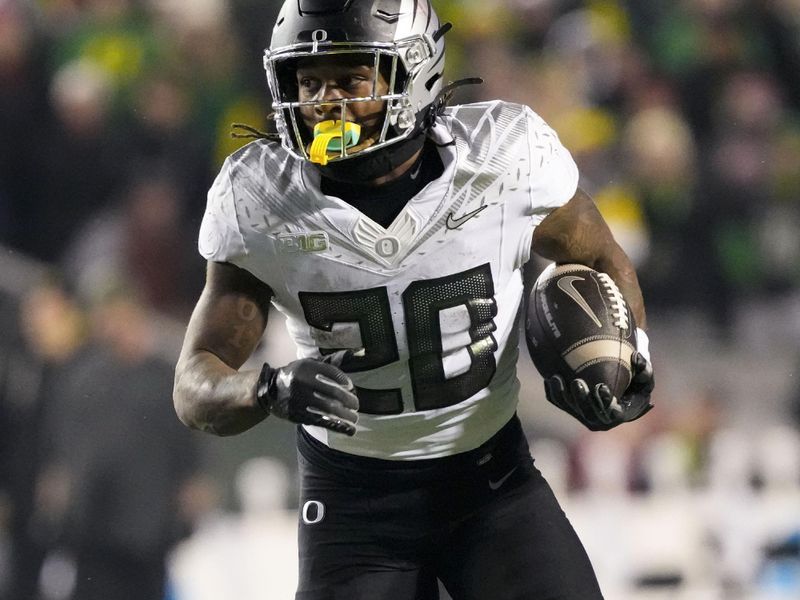 Nov 16, 2024; Madison, Wisconsin, USA;  Oregon Ducks running back Jordan James (20) rushes with the football during the fourth quarter against the Wisconsin Badgers at Camp Randall Stadium. Mandatory Credit: Jeff Hanisch-Imagn Images