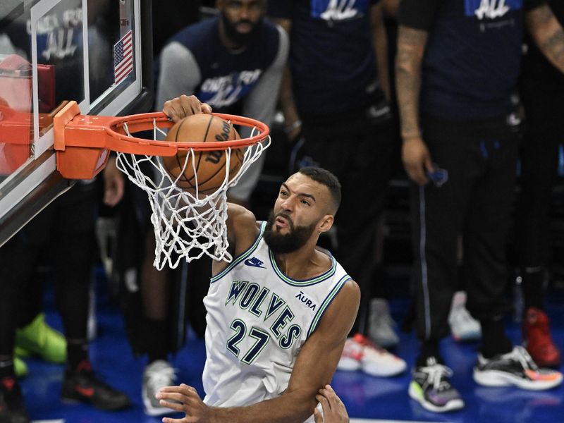 MINNEAPOLIS, MINNESOTA - MAY 24: Rudy Gobert #27 of the Minnesota Timberwolves dunks the ball against Dereck Lively II #2 of the Dallas Mavericks during the fourth quarter in Game Two of the Western Conference Finals at Target Center on May 24, 2024 in Minneapolis, Minnesota. NOTE TO USER: User expressly acknowledges and agrees that, by downloading and or using this photograph, User is consenting to the terms and conditions of the Getty Images License Agreement. (Photo by Stephen Maturen/Getty Images)