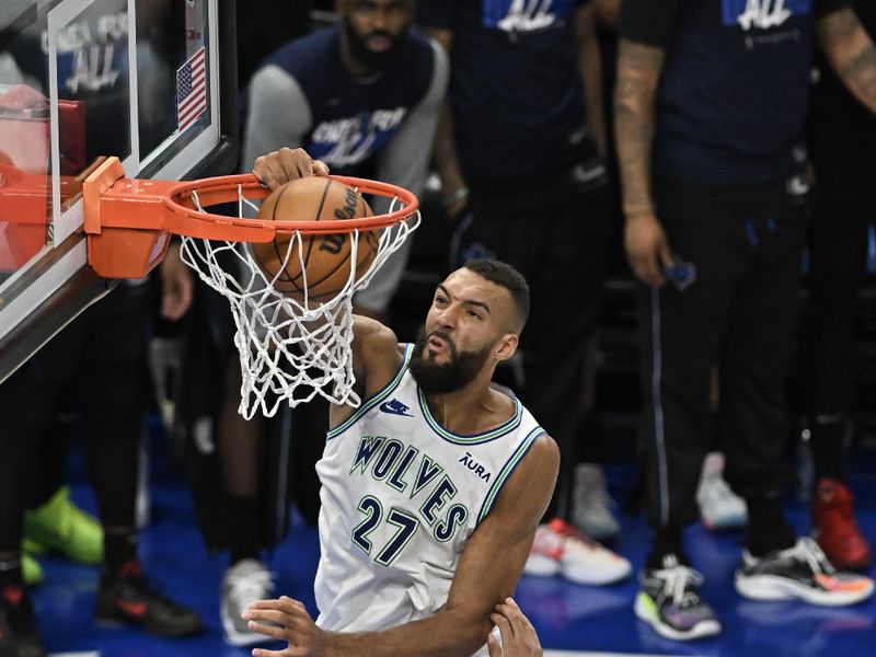 MINNEAPOLIS, MINNESOTA - MAY 24: Rudy Gobert #27 of the Minnesota Timberwolves dunks the ball against Dereck Lively II #2 of the Dallas Mavericks during the fourth quarter in Game Two of the Western Conference Finals at Target Center on May 24, 2024 in Minneapolis, Minnesota. NOTE TO USER: User expressly acknowledges and agrees that, by downloading and or using this photograph, User is consenting to the terms and conditions of the Getty Images License Agreement. (Photo by Stephen Maturen/Getty Images)