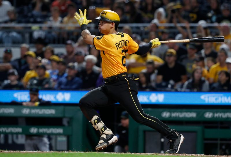 Sep 29, 2023; Pittsburgh, Pennsylvania, USA;  Pittsburgh Pirates catcher Endy Rodriguez (25) hits an RBI single against the Miami Marlins during the fourth inning at PNC Park. Mandatory Credit: Charles LeClaire-USA TODAY Sports