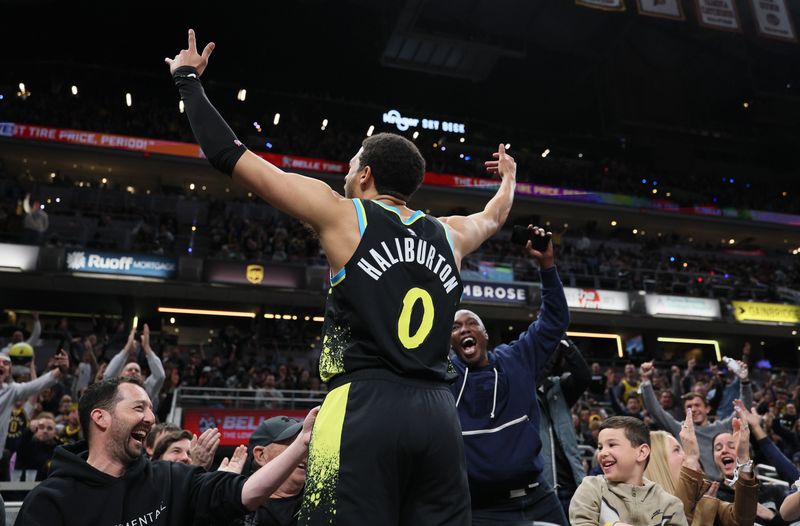 INDIANAPOLIS, INDIANA - APRIL 05: Tyrese Haliburton #0 of the Indiana Pacers celebrates after making a three point shot against the Oklahoma City Thunder at the end of the third quarter at Gainbridge Fieldhouse on April 05, 2024 in Indianapolis, Indiana.    NOTE TO USER: User expressly acknowledges and agrees that, by downloading and or using this photograph, User is consenting to the terms and conditions of the Getty Images License Agreement.  (Photo by Andy Lyons/Getty Images)